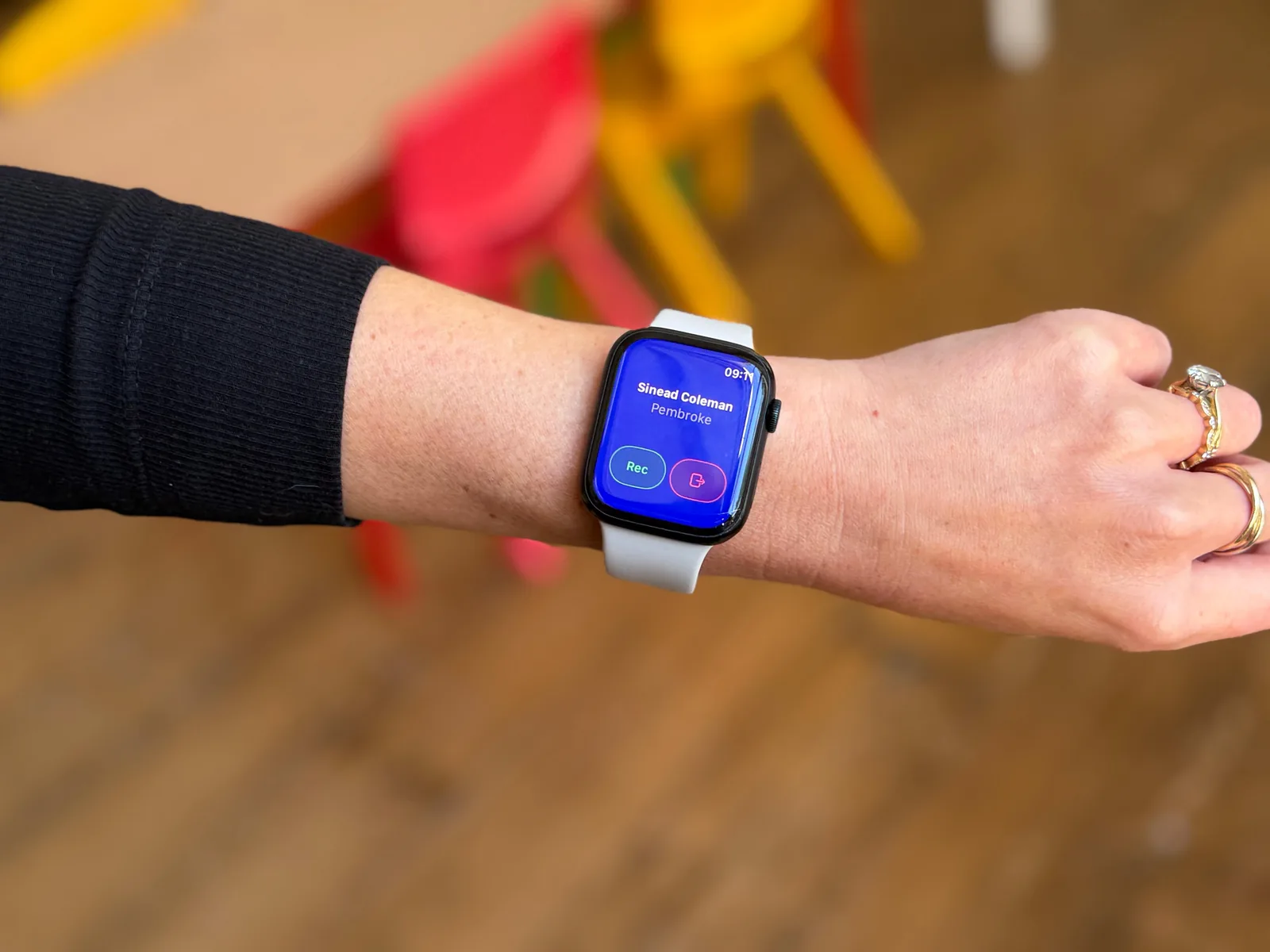 An educator wearing an Apple Watch running Tot Tracker, recording an Instant Observation in a Montessori classroom
